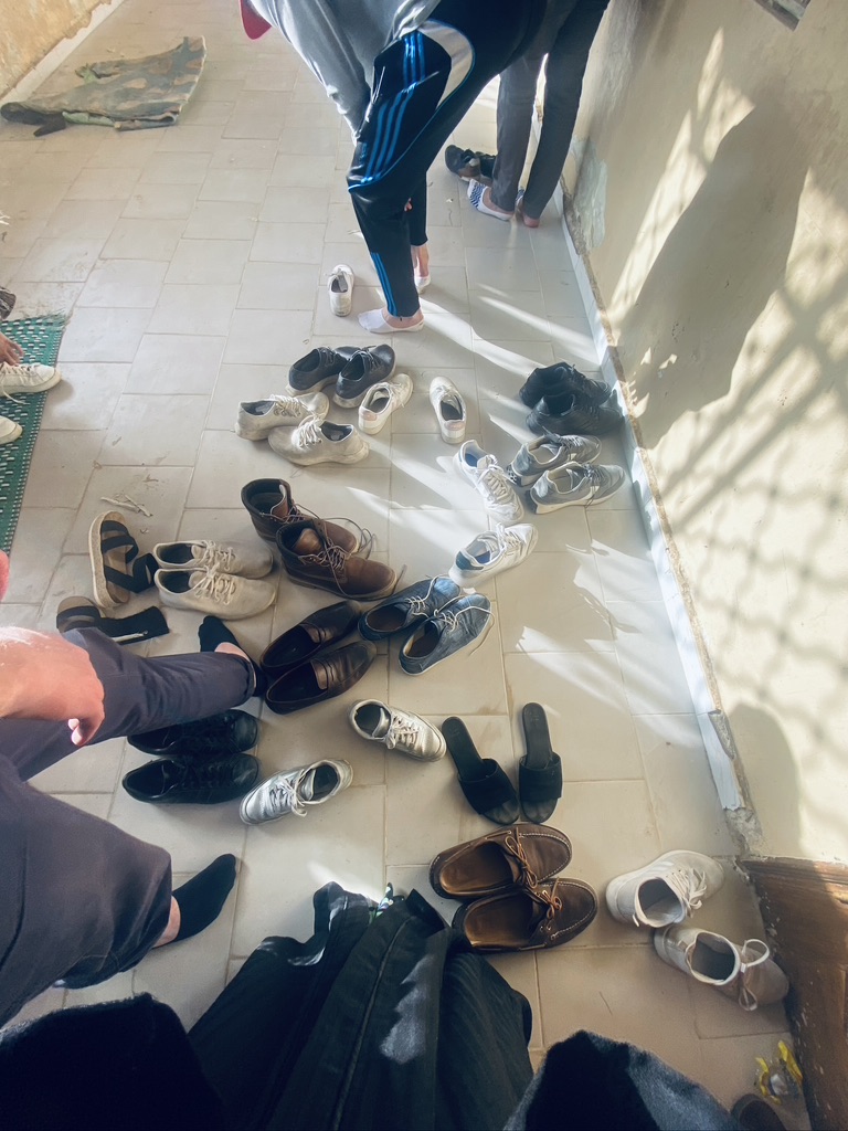 removing shoes before entering the mosque IN SENEGAL